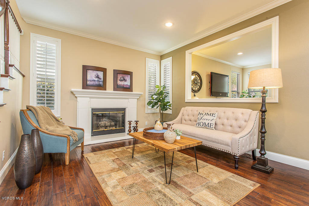11249 Shadyridge Road Moorpark, CA 93021 - Photo 12 of 48 a living room with furniture and a fireplace