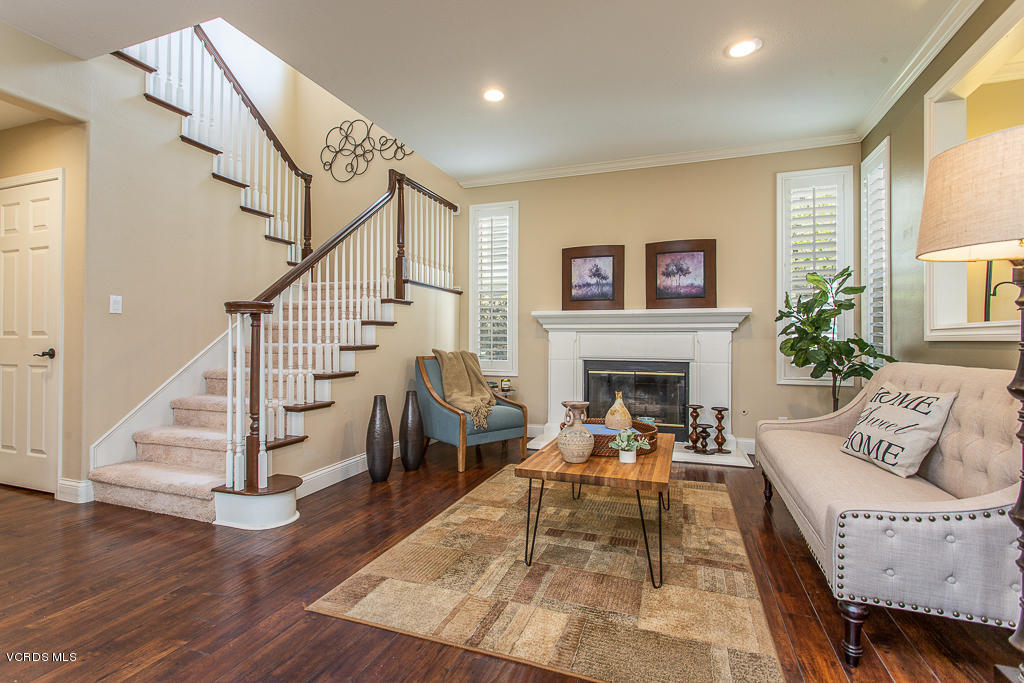11249 Shadyridge Road Moorpark, CA 93021 - Photo 13 of 48 a living room with furniture and a fireplace