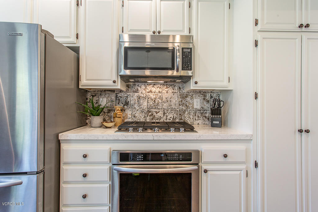 11249 Shadyridge Road Moorpark, CA 93021 - Photo 15 of 48 a stove top oven sitting inside of a kitchen