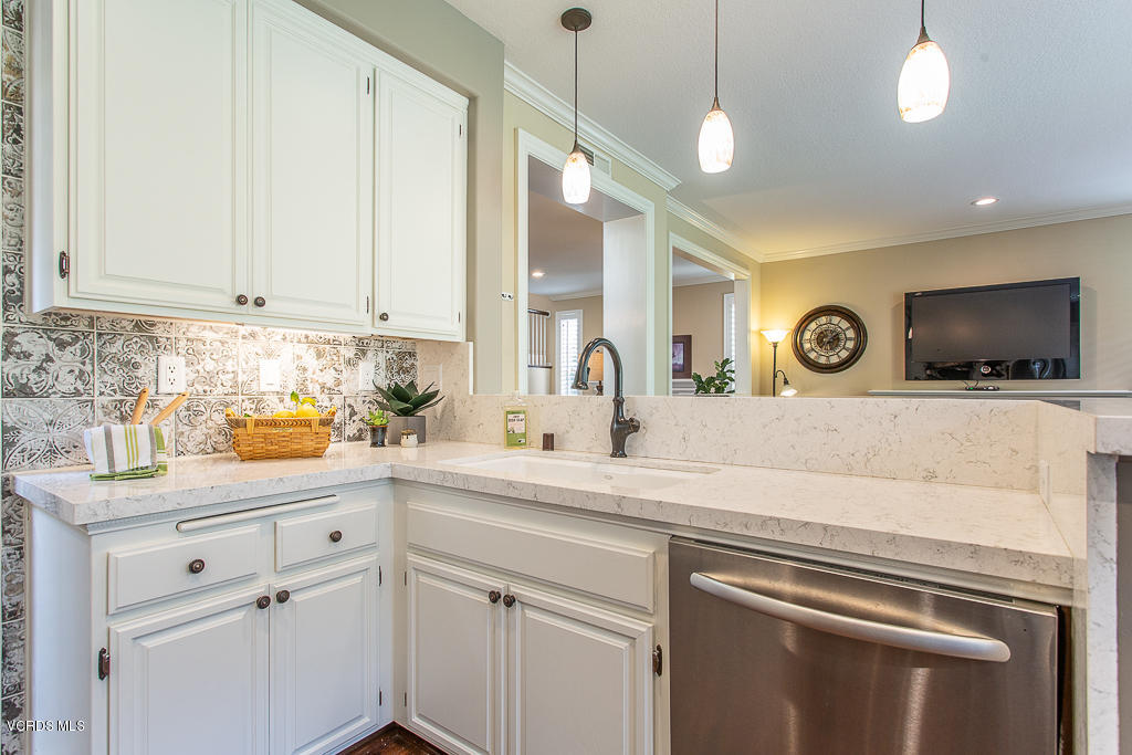 11249 Shadyridge Road Moorpark, CA 93021 - Photo 17 of 48 a kitchen with stainless steel appliances white cabinets and a sink