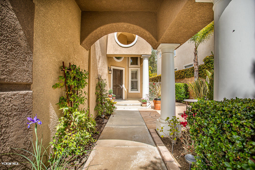 11249 Shadyridge Road Moorpark, CA 93021 - Photo 3 of 48 a front view of a house with a garden