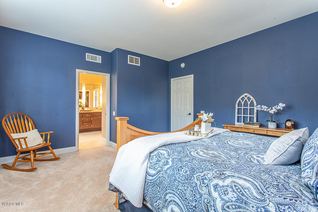 11249 Shadyridge Road Moorpark, CA 93021 - Photo 22 of 48 a bedroom with a bed a table and chair