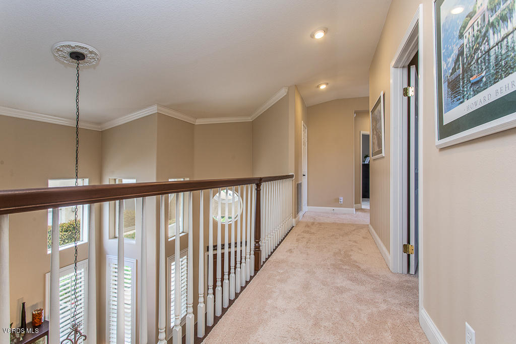 11249 Shadyridge Road Moorpark, CA 93021 - Photo 26 of 48 a view of a hallway with wooden floor and windows