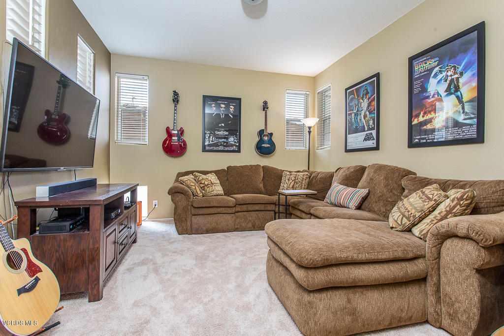11249 Shadyridge Road Moorpark, CA 93021 - Photo 27 of 48 a living room with furniture and a flat screen tv