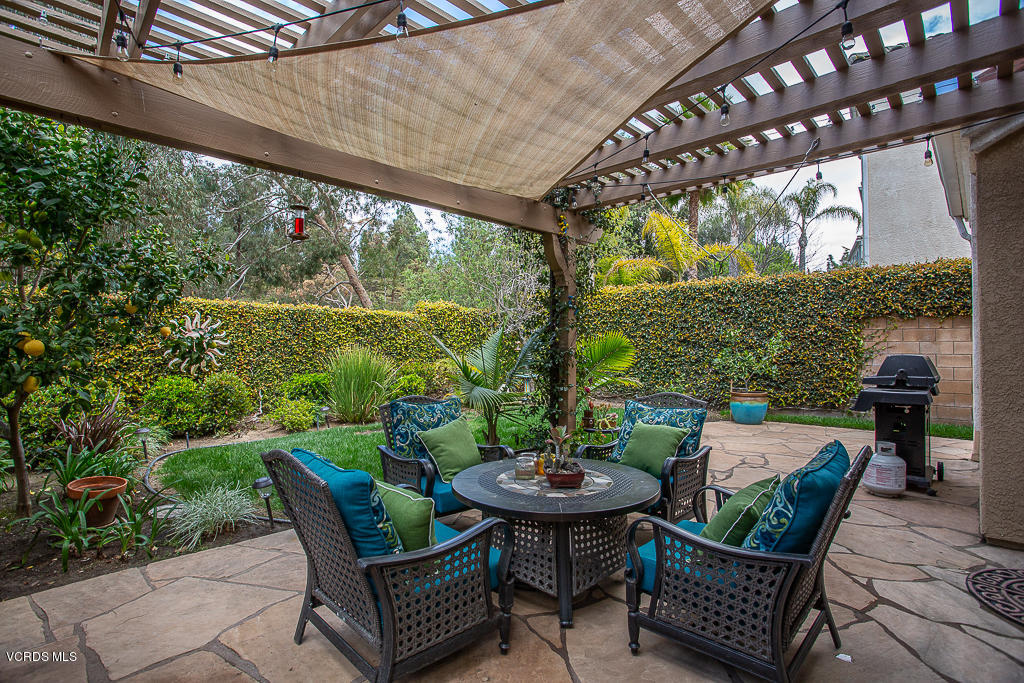 11249 Shadyridge Road Moorpark, CA 93021 - Photo 38 of 48 a view of a porch with furniture and a yard