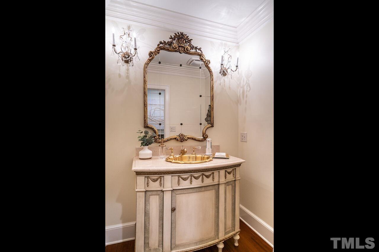 903 Wakestone Court Raleigh, NC 27609 - Photo 18 of 40 a bathroom with a sink and a mirror