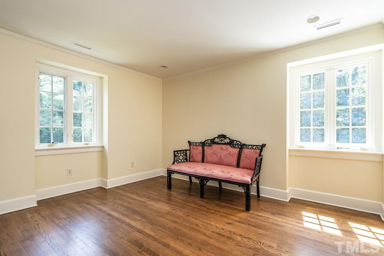 903 Wakestone Court Raleigh, NC 27609 - Photo 25 of 40 a wooden bench sitting in front of a window