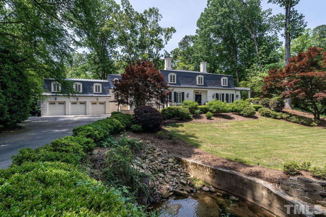 903 Wakestone Court Raleigh, NC 27609 - Photo 3 of 40 a front view of a house with a yard