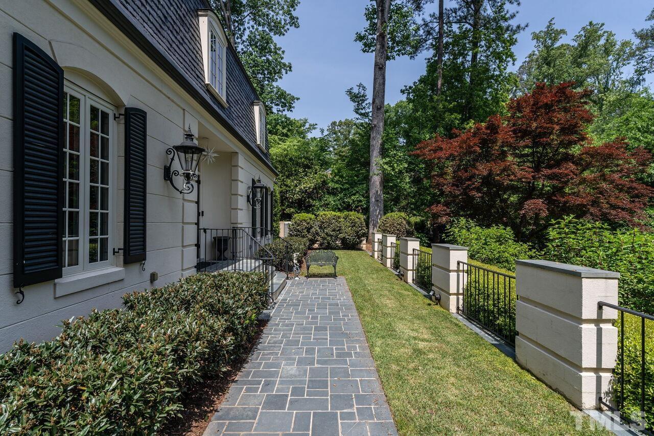 903 Wakestone Court Raleigh, NC 27609 - Photo 4 of 40 a view of a house with backyard and sitting area