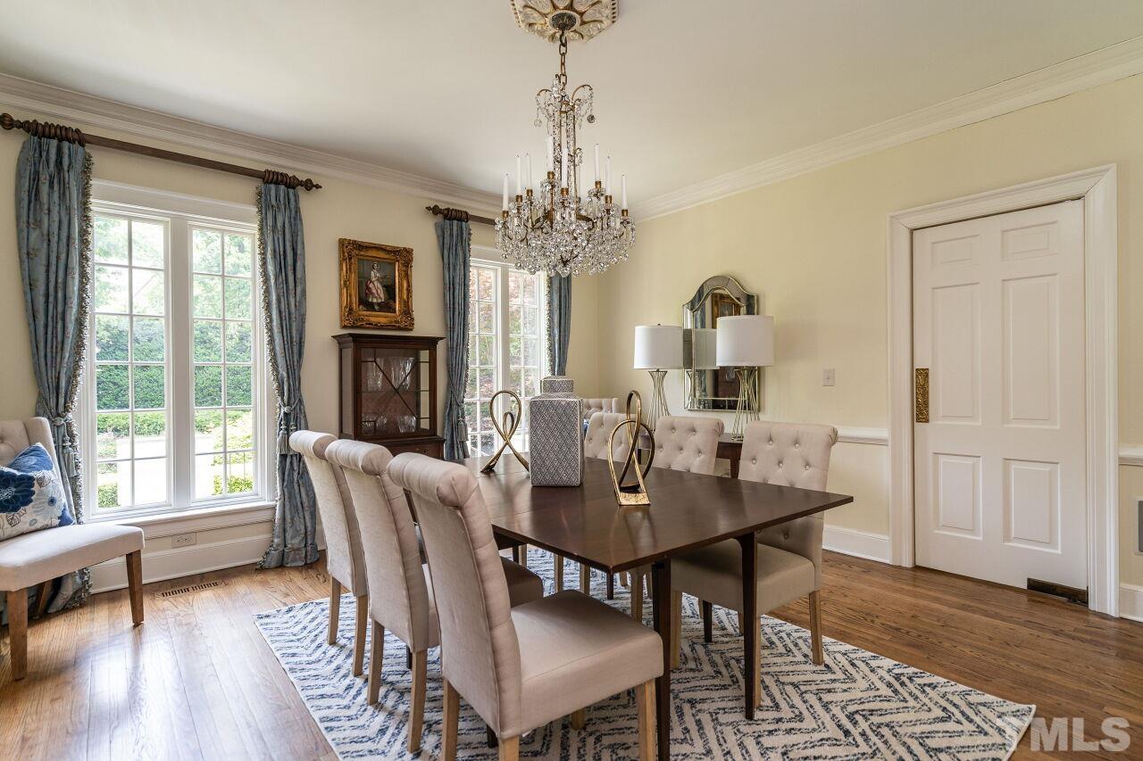 903 Wakestone Court Raleigh, NC 27609 - Photo 9 of 40 a view of a dining room with furniture window and wooden floor