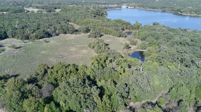 an aerial view of residential house with outdoor space