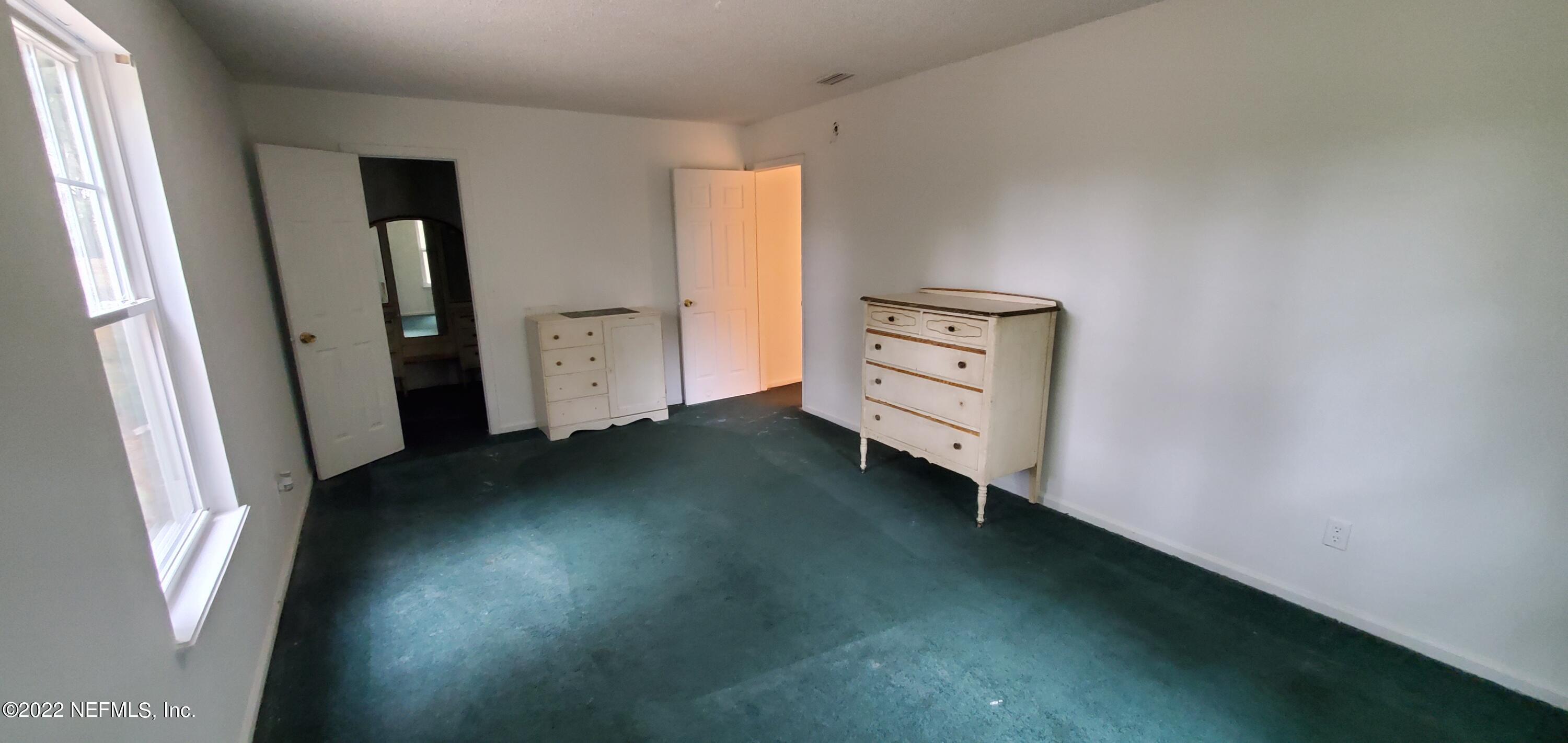 3578 Hamp Hicks Road Bryceville, FL 32009 - Photo 11 of 16 an empty room with a window