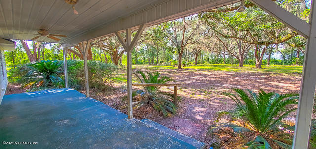 3578 Hamp Hicks Road Bryceville, FL 32009 - Photo 13 of 16 a view of a yard with palm trees