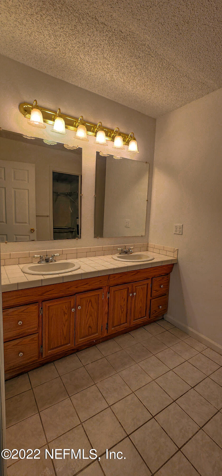 3578 Hamp Hicks Road Bryceville, FL 32009 - Photo 8 of 16 a bathroom with a granite countertop sink and a mirror