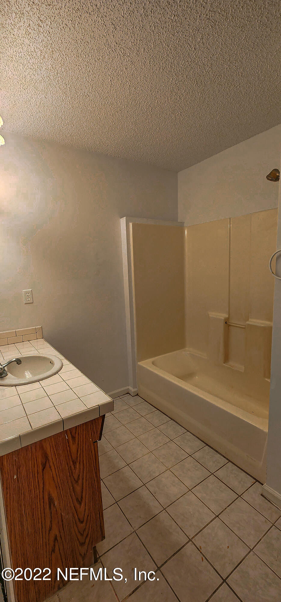 3578 Hamp Hicks Road Bryceville, FL 32009 - Photo 10 of 16 a bathroom with a sink a toilet and shower