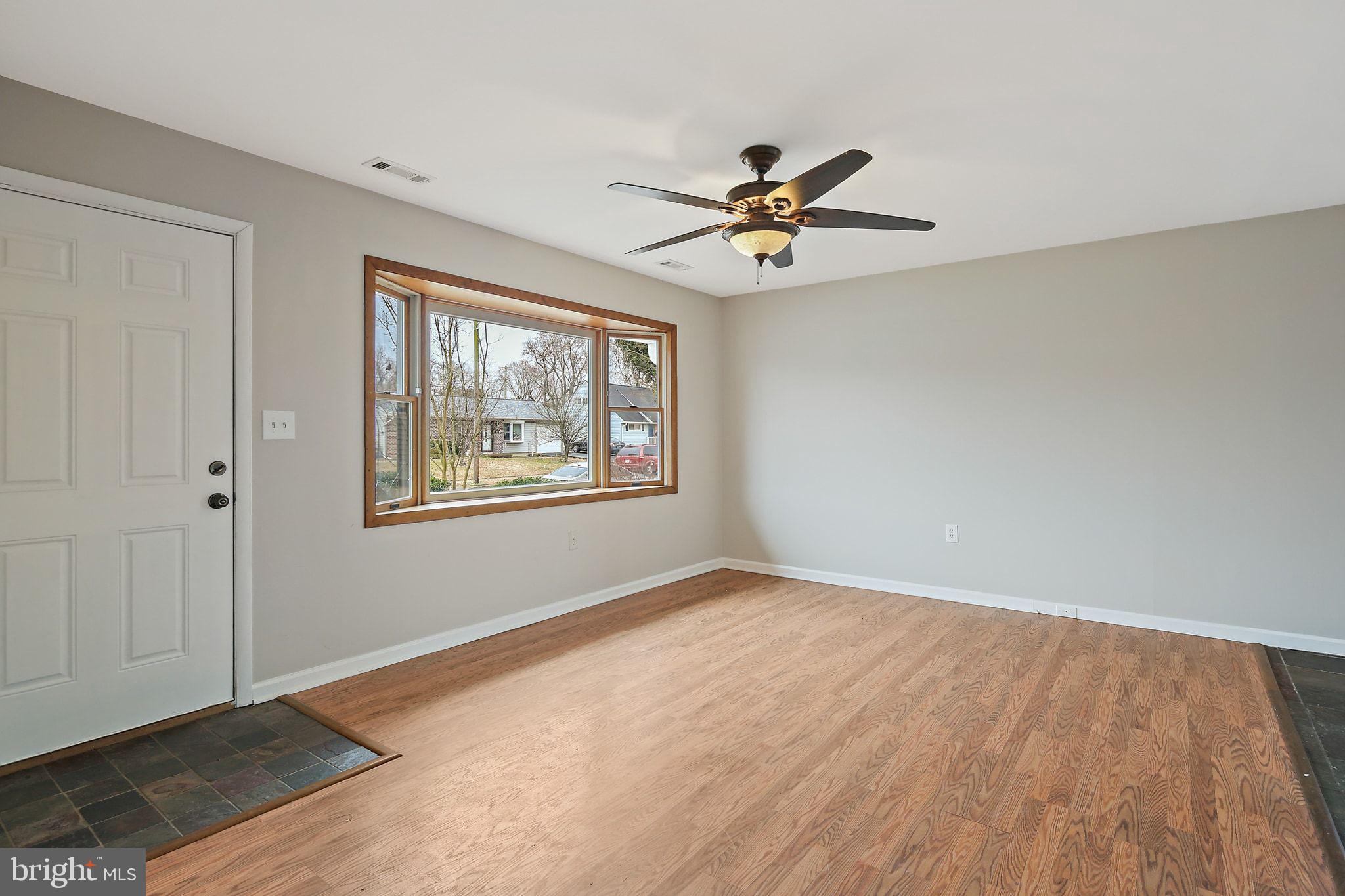 1430 Oakdale Road Glen Burnie, MD 21060 - Photo 29 of 34 a view of empty room with window and ceiling fan