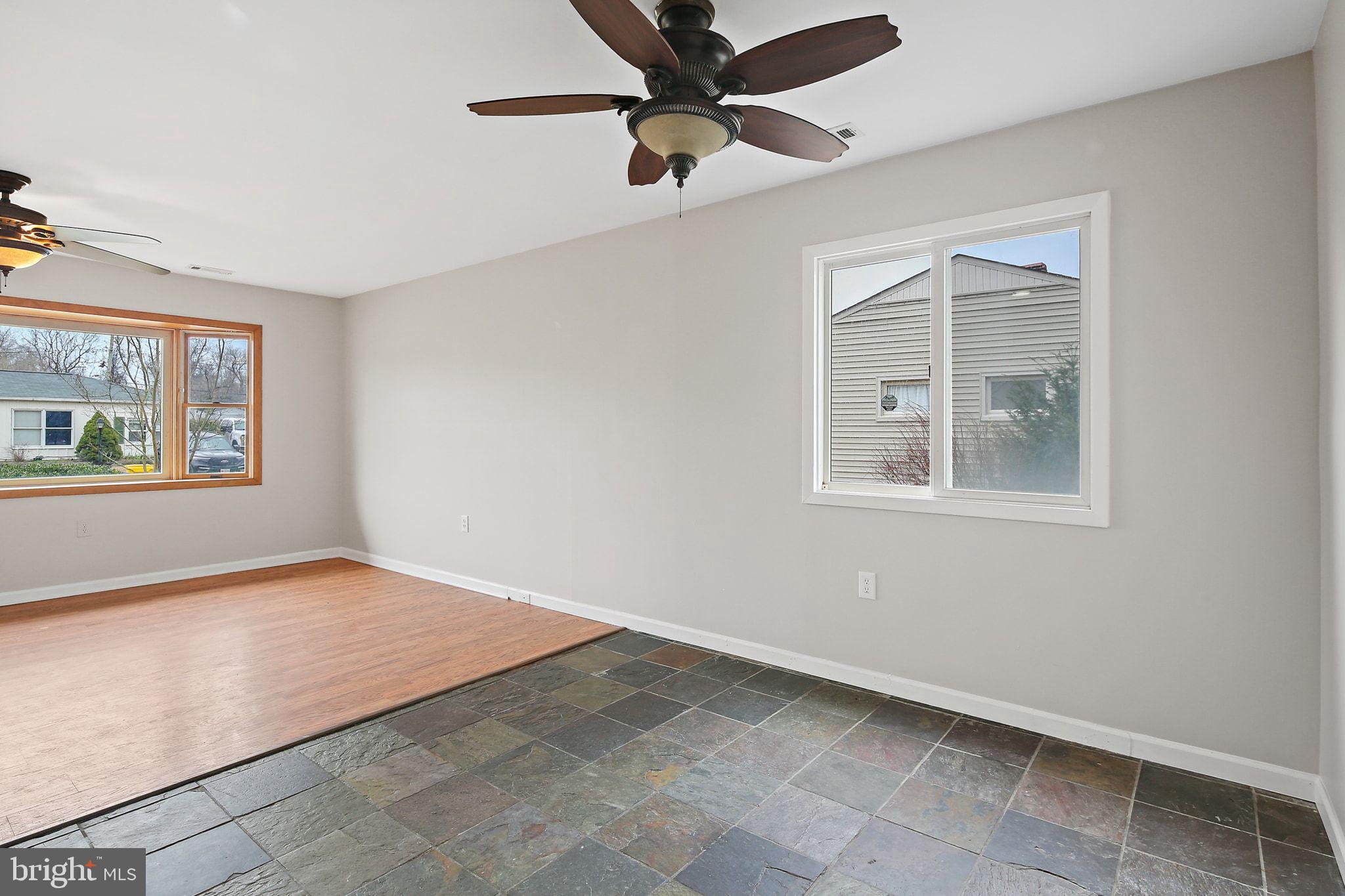 1430 Oakdale Road Glen Burnie, MD 21060 - Photo 10 of 34 a view of an empty room with a window and a ceiling fan