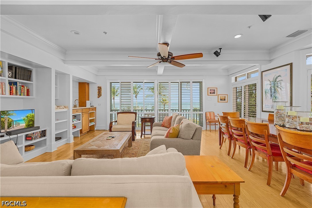 128 Useppa Island Useppa Island, FL 33922 - Photo 12 of 50 a living room with furniture kitchen view and a large window