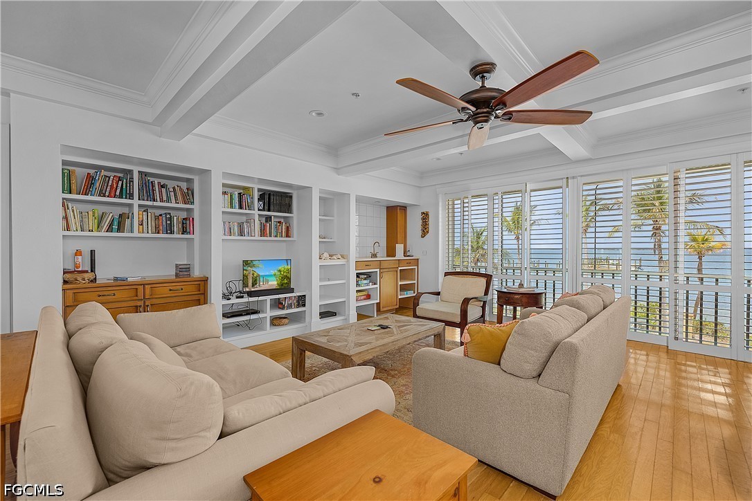 128 Useppa Island Useppa Island, FL 33922 - Photo 13 of 50 a living room with furniture ceiling fan and a wooden floor