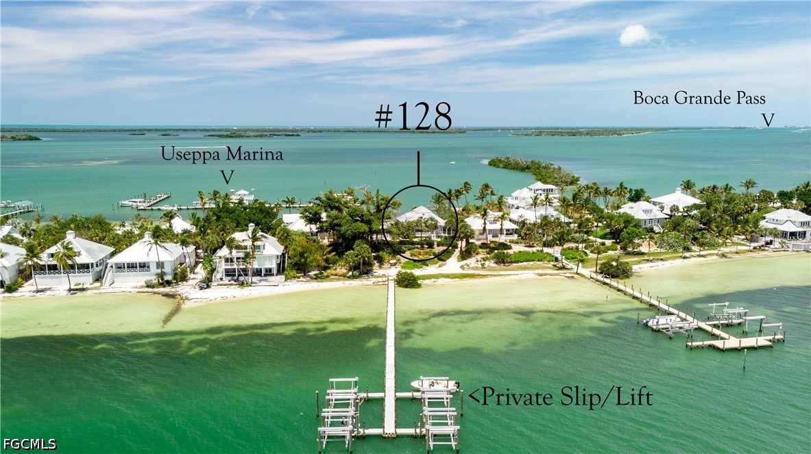128 Useppa Island Useppa Island, FL 33922 - Photo 2 of 50 a view of a lake with a big yard