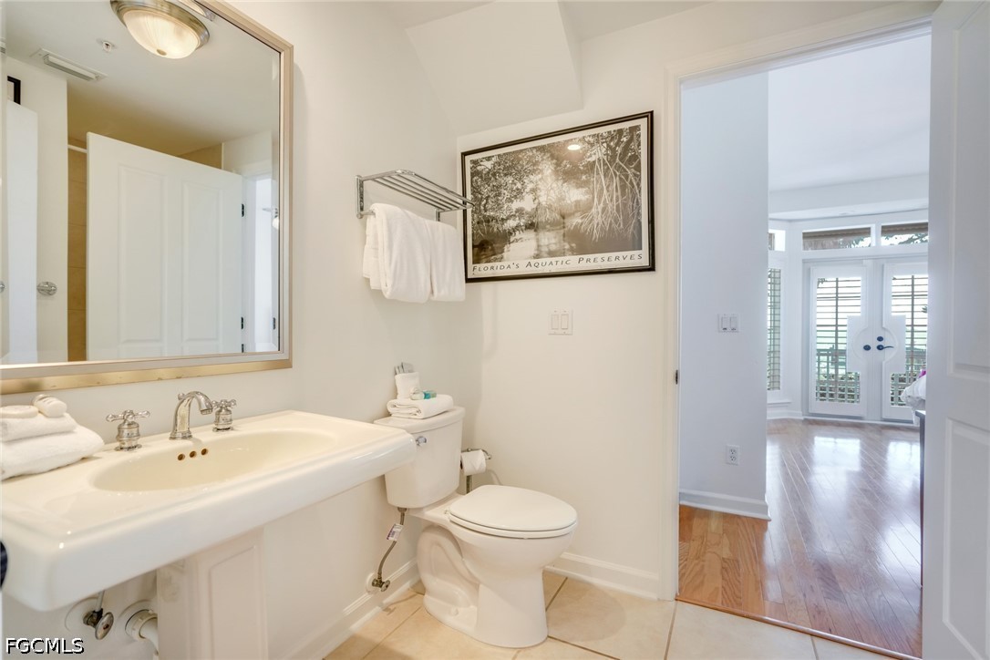 128 Useppa Island Useppa Island, FL 33922 - Photo 25 of 50 a bathroom with a toilet a sink and mirror