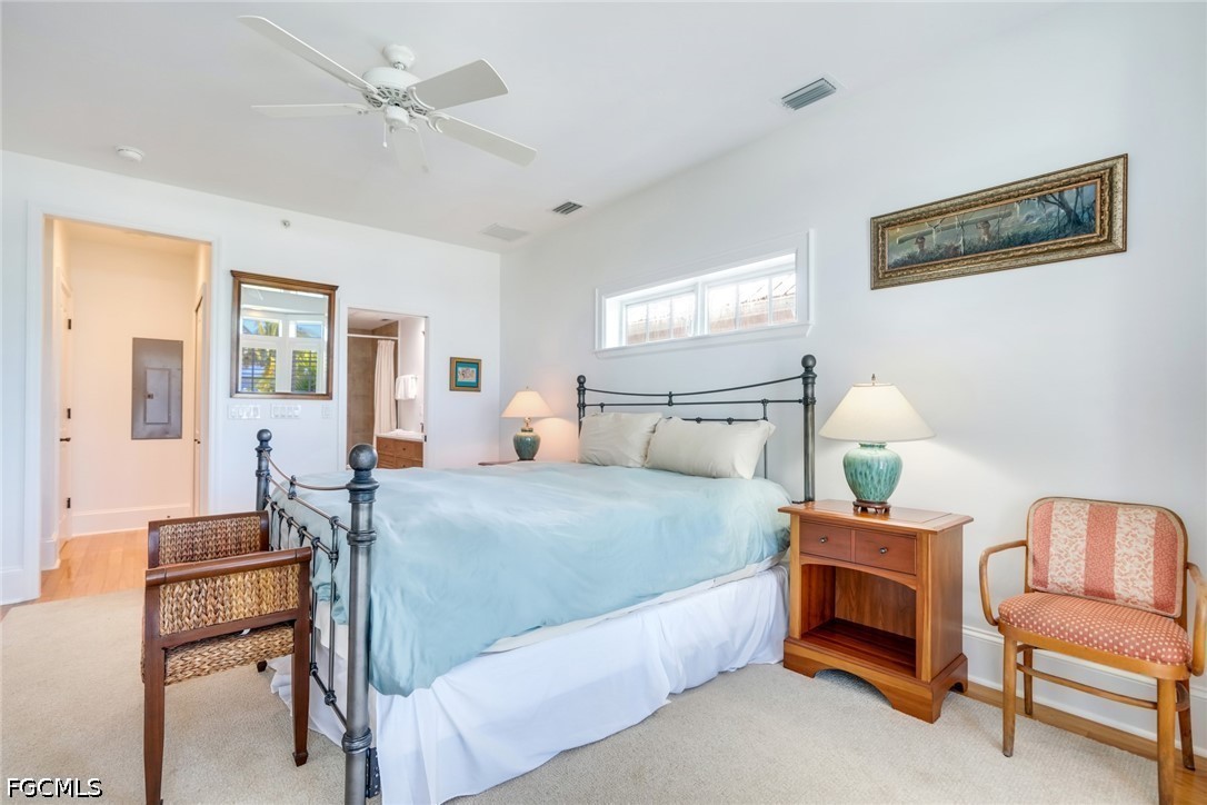 128 Useppa Island Useppa Island, FL 33922 - Photo 27 of 50 a bedroom with a bed and a chair