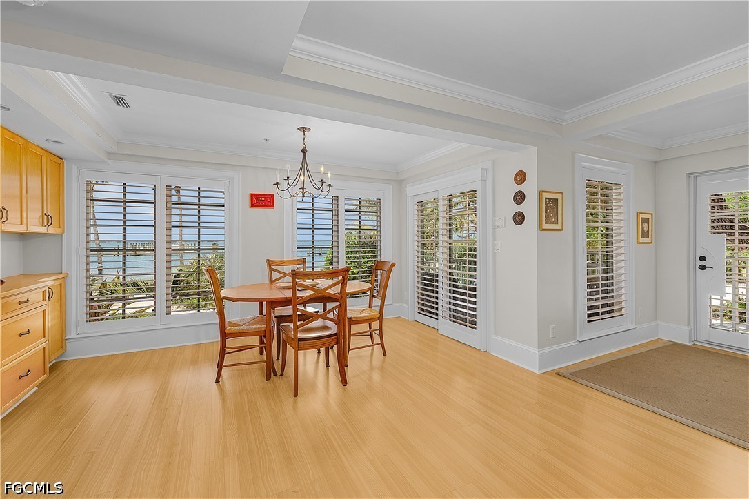 128 Useppa Island Useppa Island, FL 33922 - Photo 43 of 50 a dining room with furniture and wooden floor