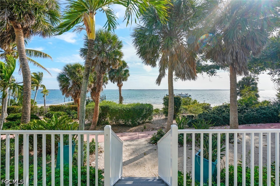 128 Useppa Island Useppa Island, FL 33922 - Photo 10 of 50 a view of a pathway with a wrought fence