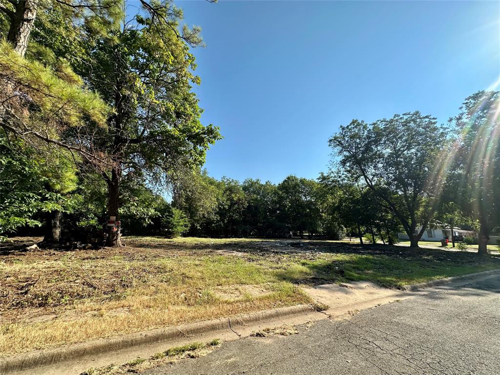 358 13th Street Southwest Paris, TX 75460 - Photo 4 of 5 View of asphalt street with curbs