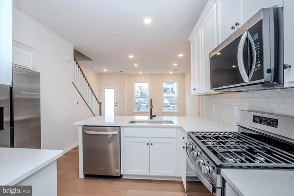 a kitchen with a stove and a microwave