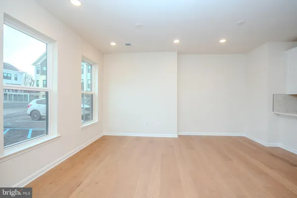 a view of room with window and hardwood floor