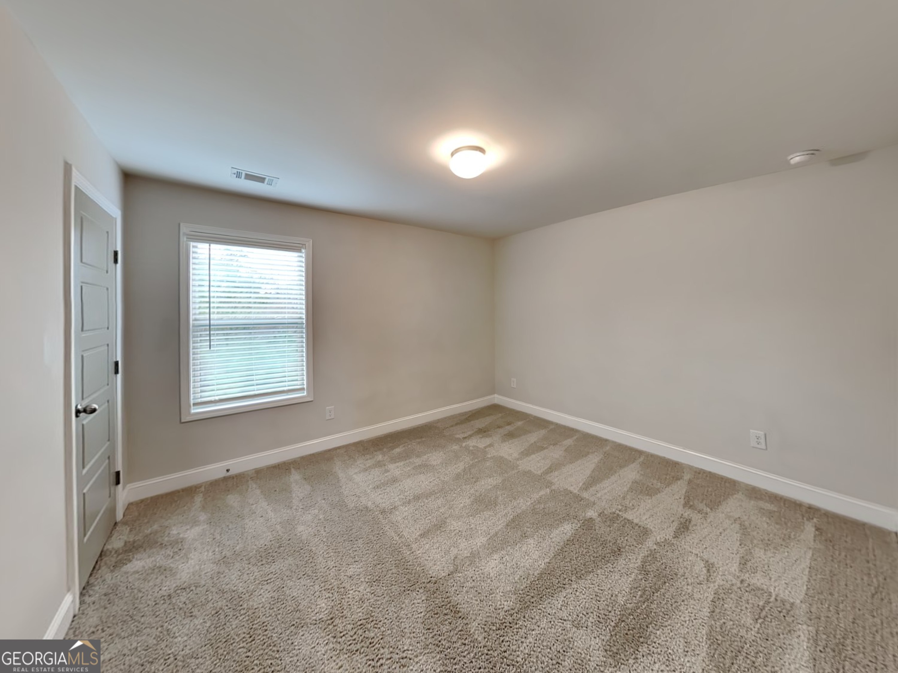 1781 Cobblefield Circle Dacula, GA 30019 - Photo 16 of 27 an empty room with a window