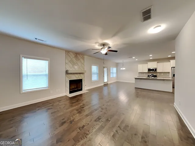 a view of a kitchen with a sink and a fireplace