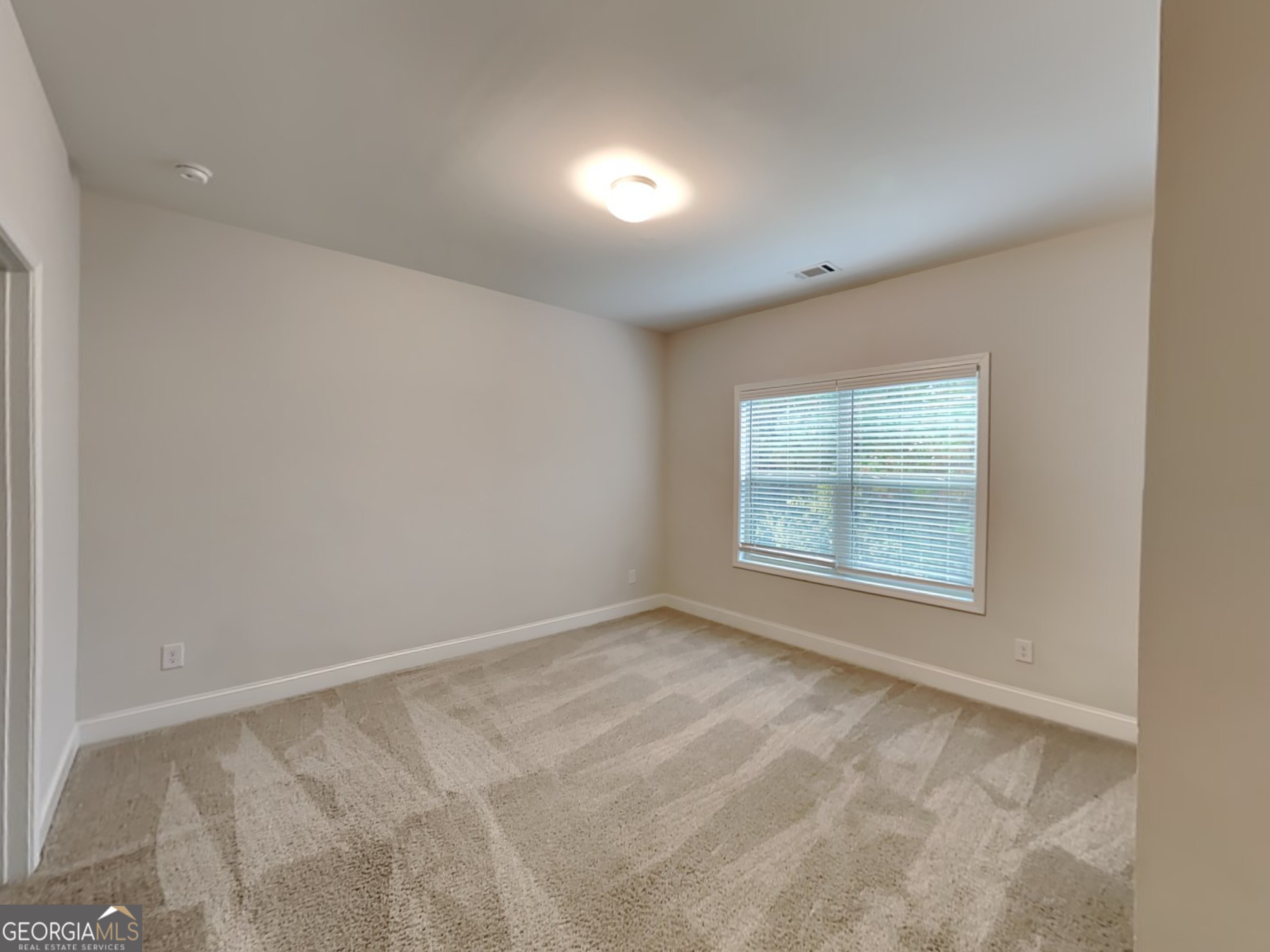 1781 Cobblefield Circle Dacula, GA 30019 - Photo 10 of 27 an empty room with a window