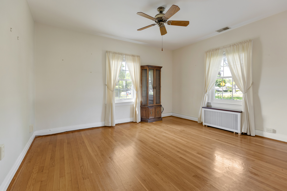 216 Center Avenue Wheeling, IL 60090 - Photo 12 of 25 a view of empty room with wooden floor and fan