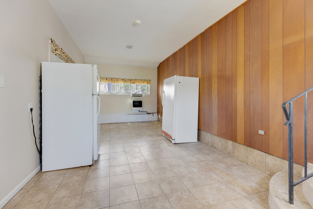 216 Center Avenue Wheeling, IL 60090 - Photo 21 of 25 a view of a kitchen with refrigerator and front door