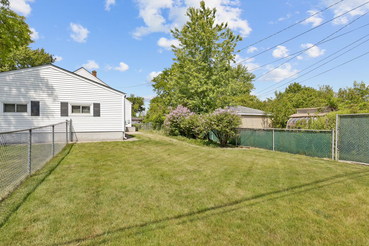216 Center Avenue Wheeling, IL 60090 - Photo 24 of 25 a view of backyard of house with green space