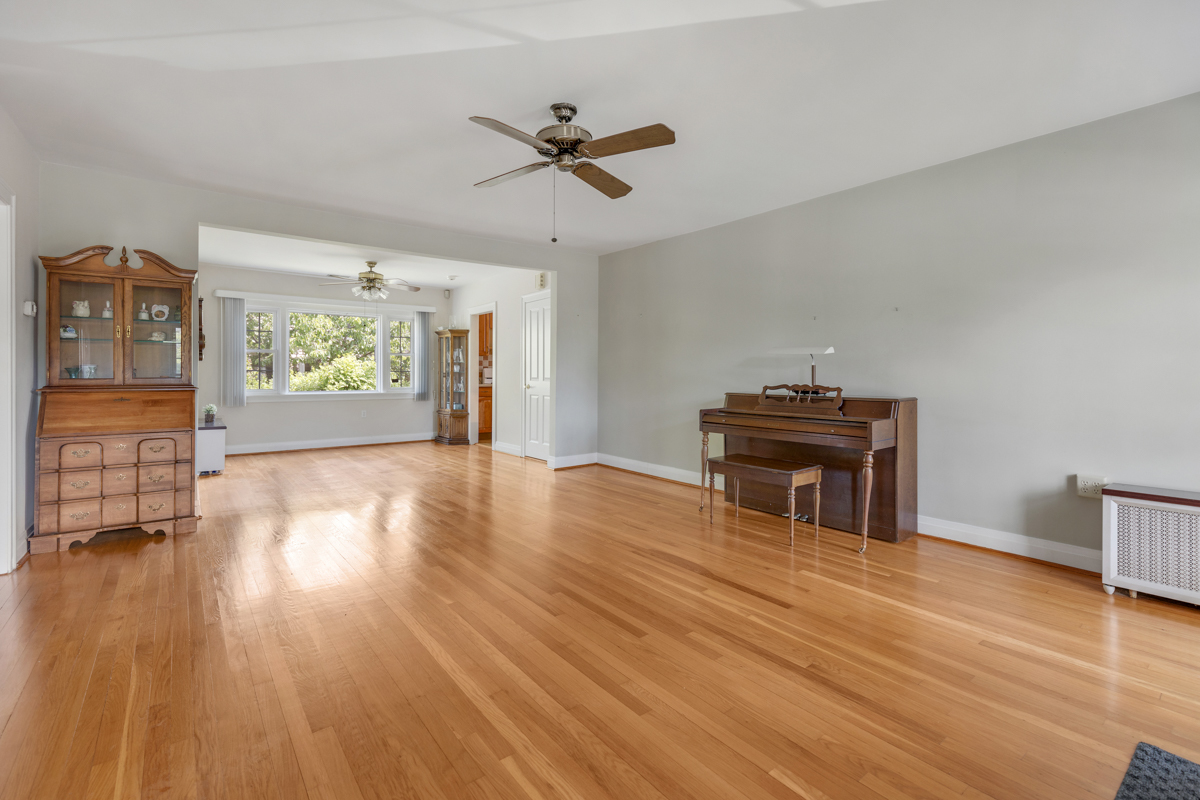 216 Center Avenue Wheeling, IL 60090 - Photo 5 of 25 a view of empty room with wooden floor and fan