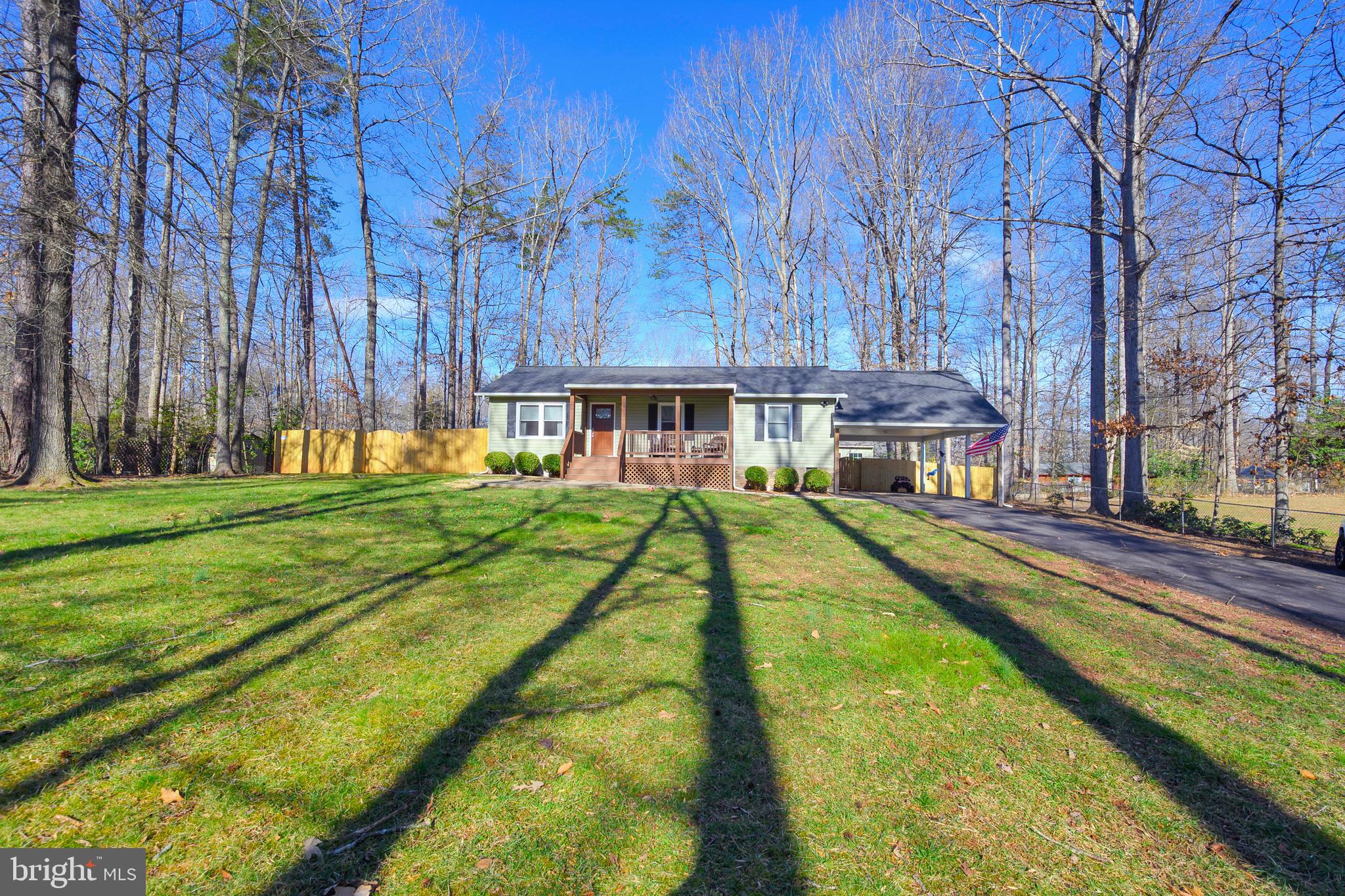 28 Benner Loop Ruther Glen, VA 22546 - Photo 20 of 54 a view of house with a swimming pool