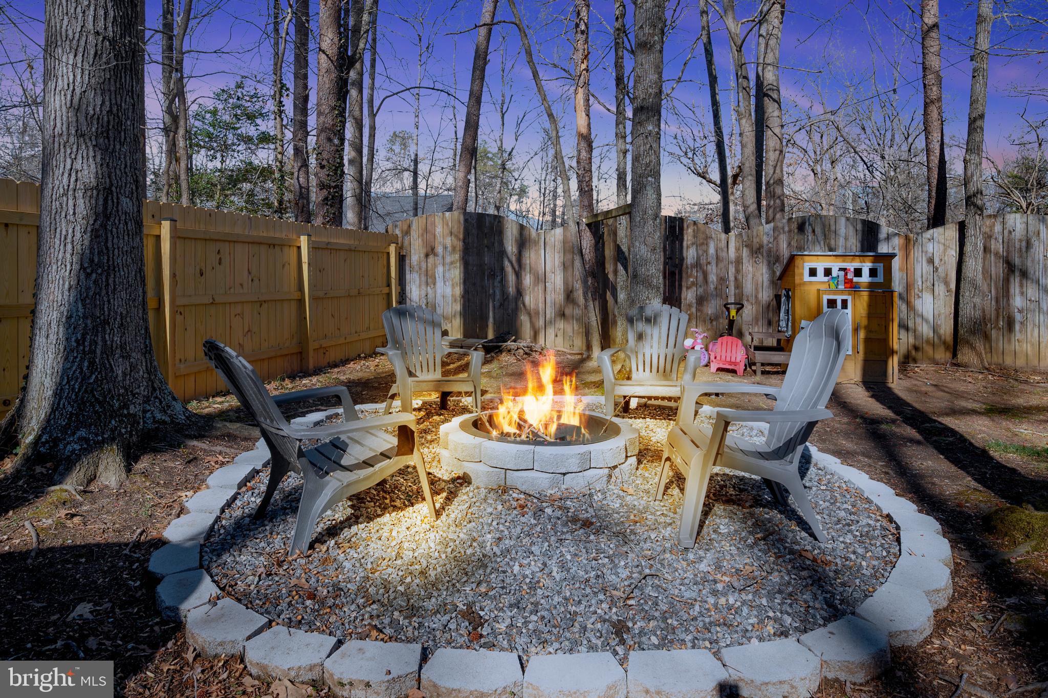 28 Benner Loop Ruther Glen, VA 22546 - Photo 2 of 54 a view of a chairs and table in backyard