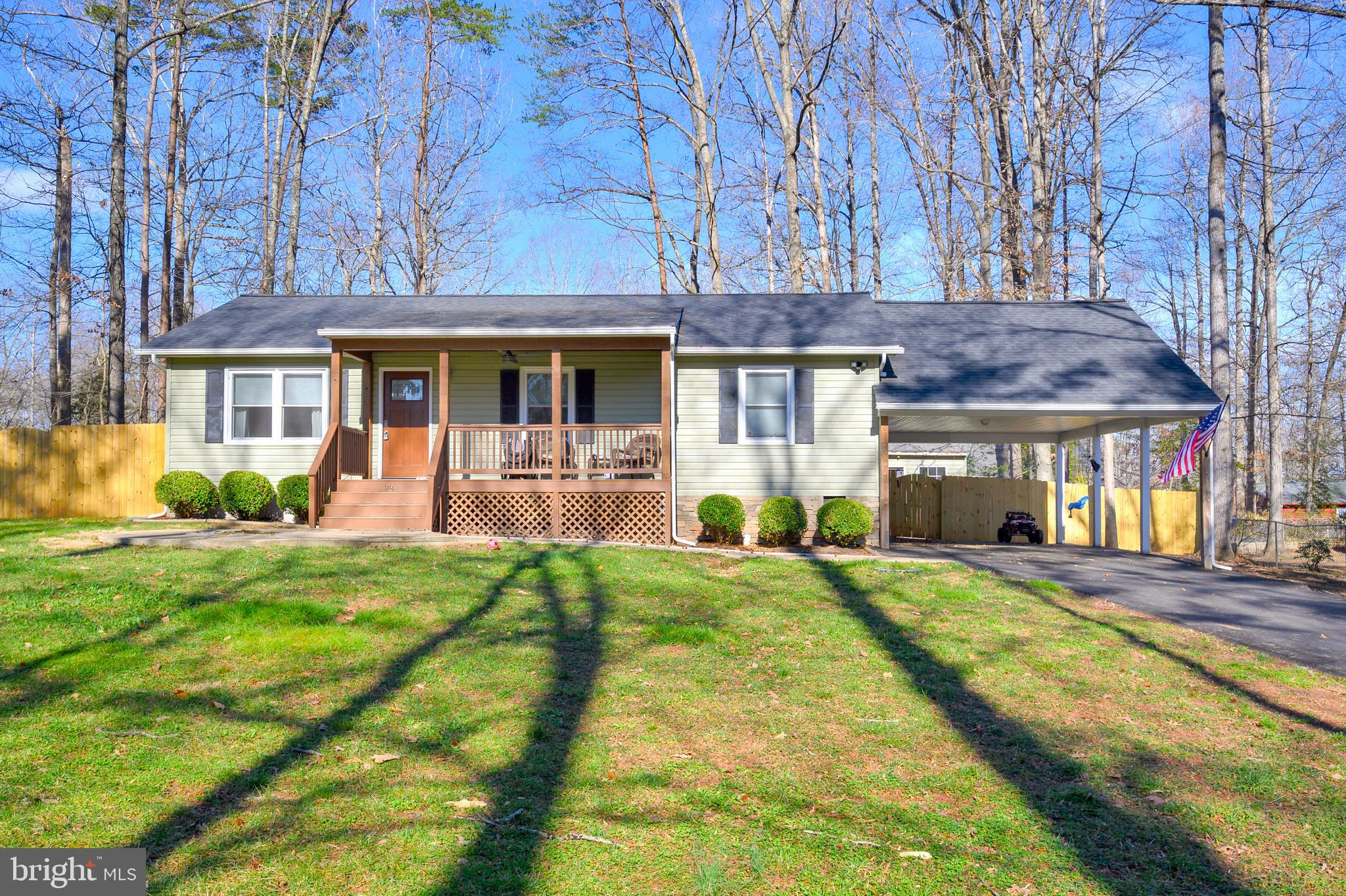 28 Benner Loop Ruther Glen, VA 22546 - Photo 21 of 54 a front view of a house with yard and green space