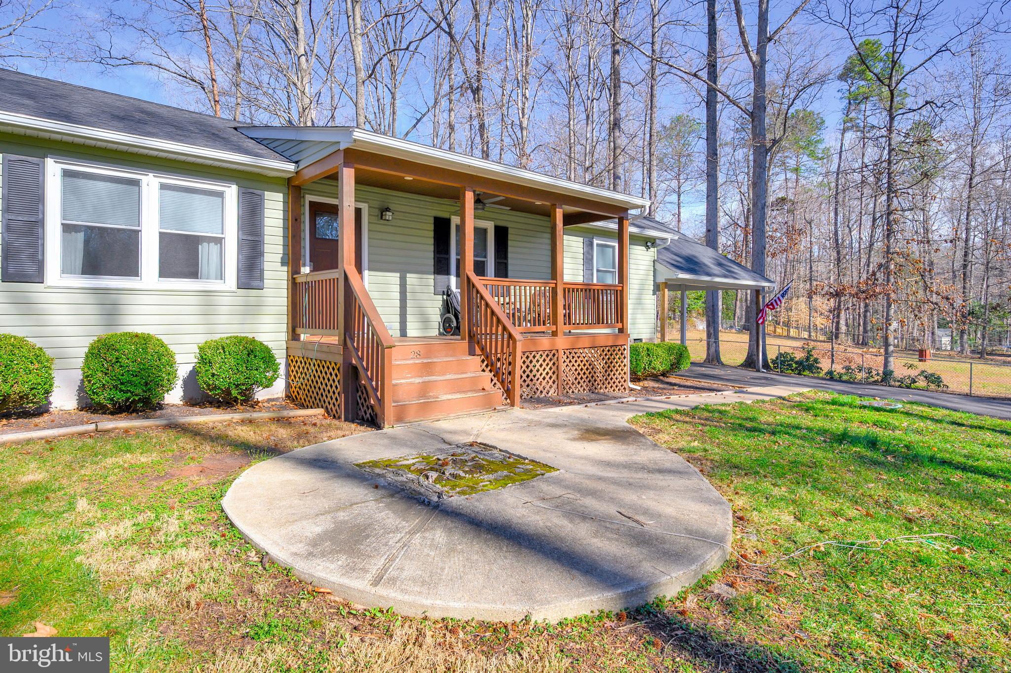 28 Benner Loop Ruther Glen, VA 22546 - Photo 23 of 54 a front view of a house with a yard