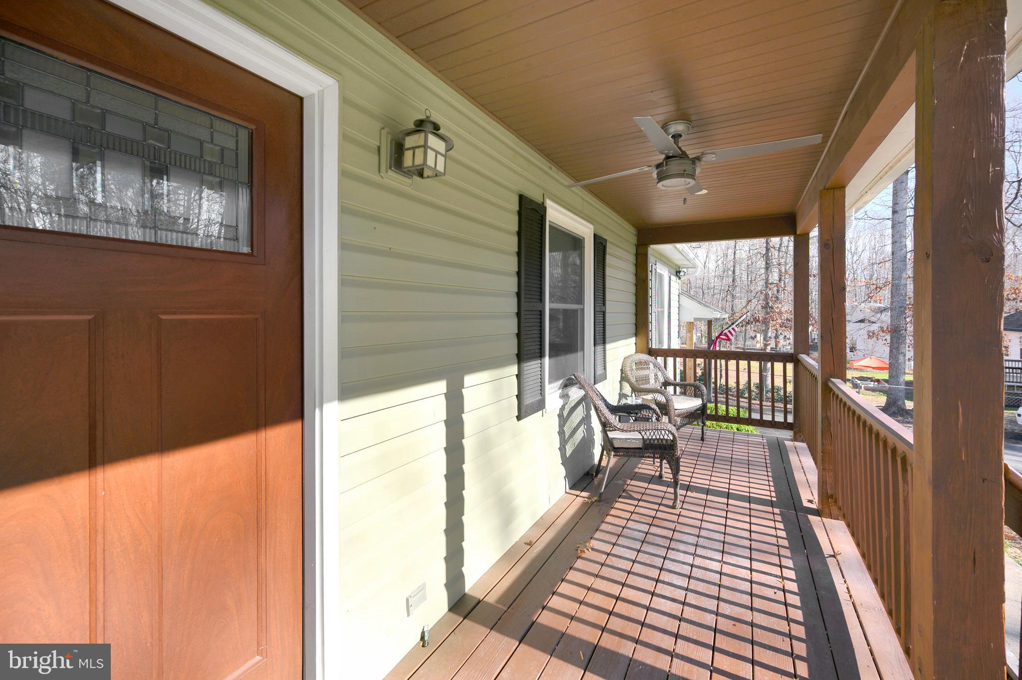 28 Benner Loop Ruther Glen, VA 22546 - Photo 24 of 54 a balcony with wooden floor and outdoor space