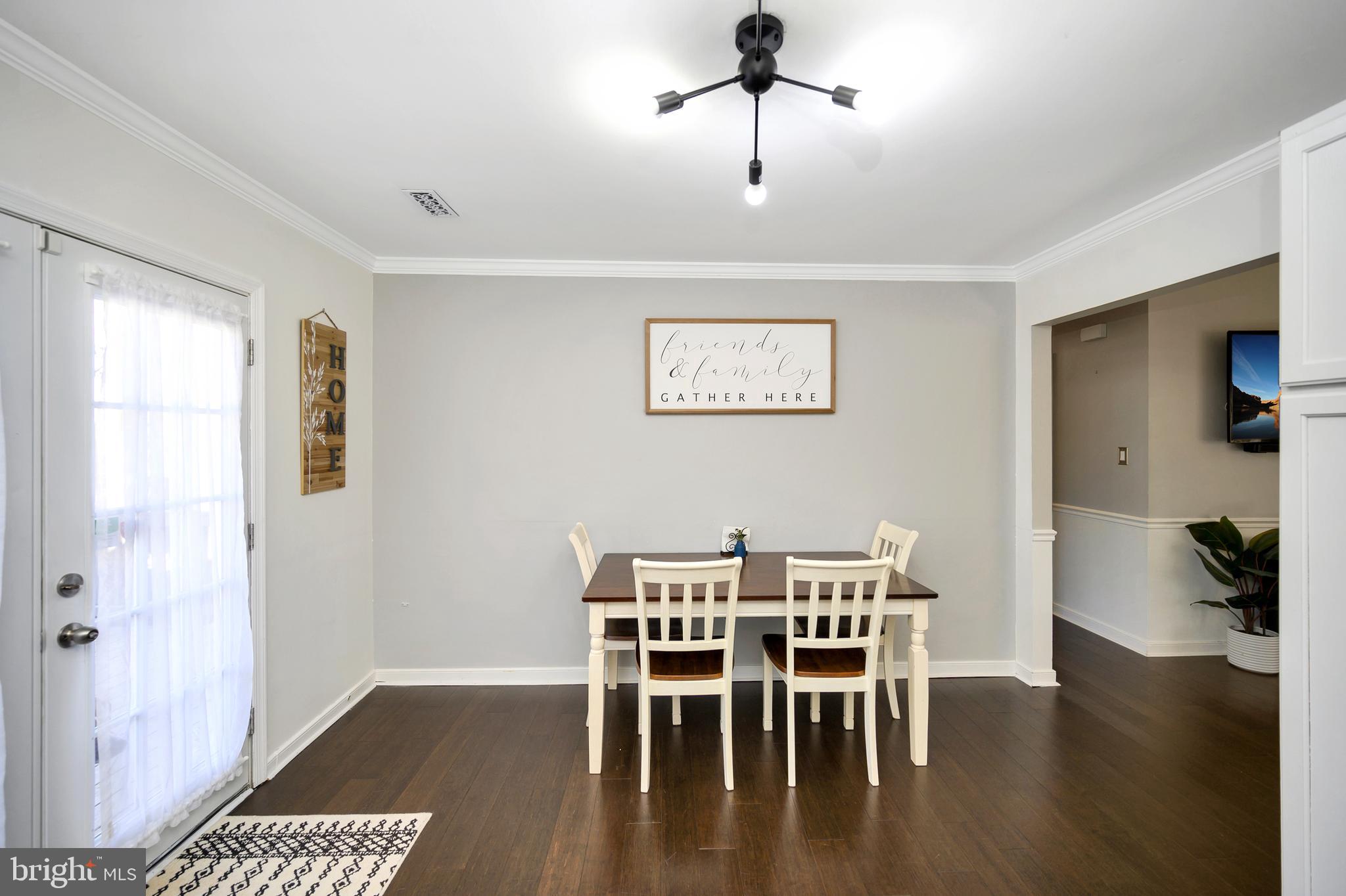 28 Benner Loop Ruther Glen, VA 22546 - Photo 32 of 54 a view of a dining room with furniture and wooden floor