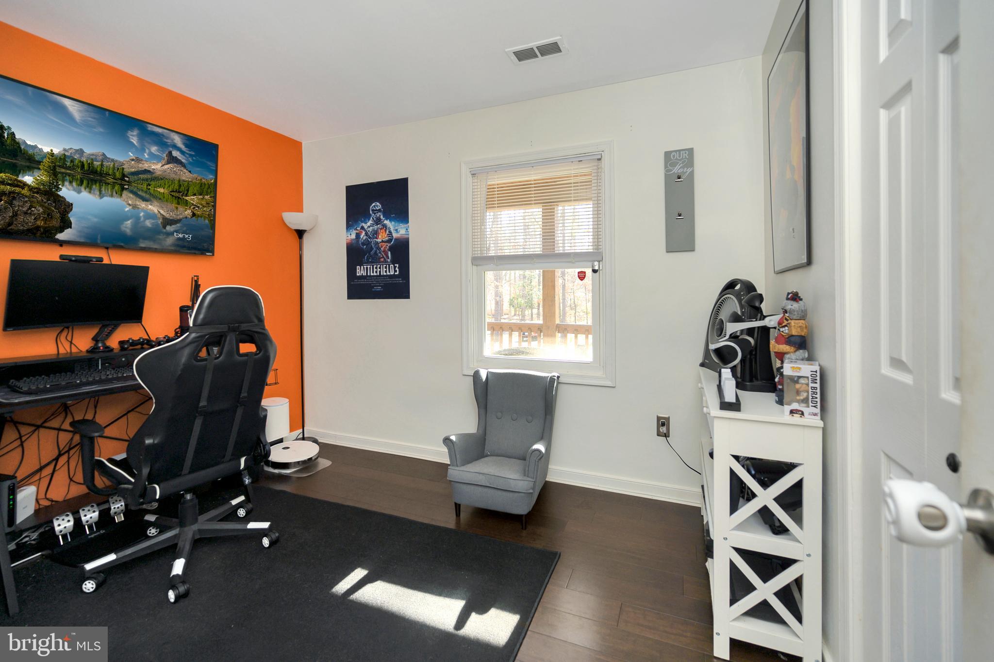 28 Benner Loop Ruther Glen, VA 22546 - Photo 36 of 54 a view of workspace with wooden floor windows gym equipment and windows