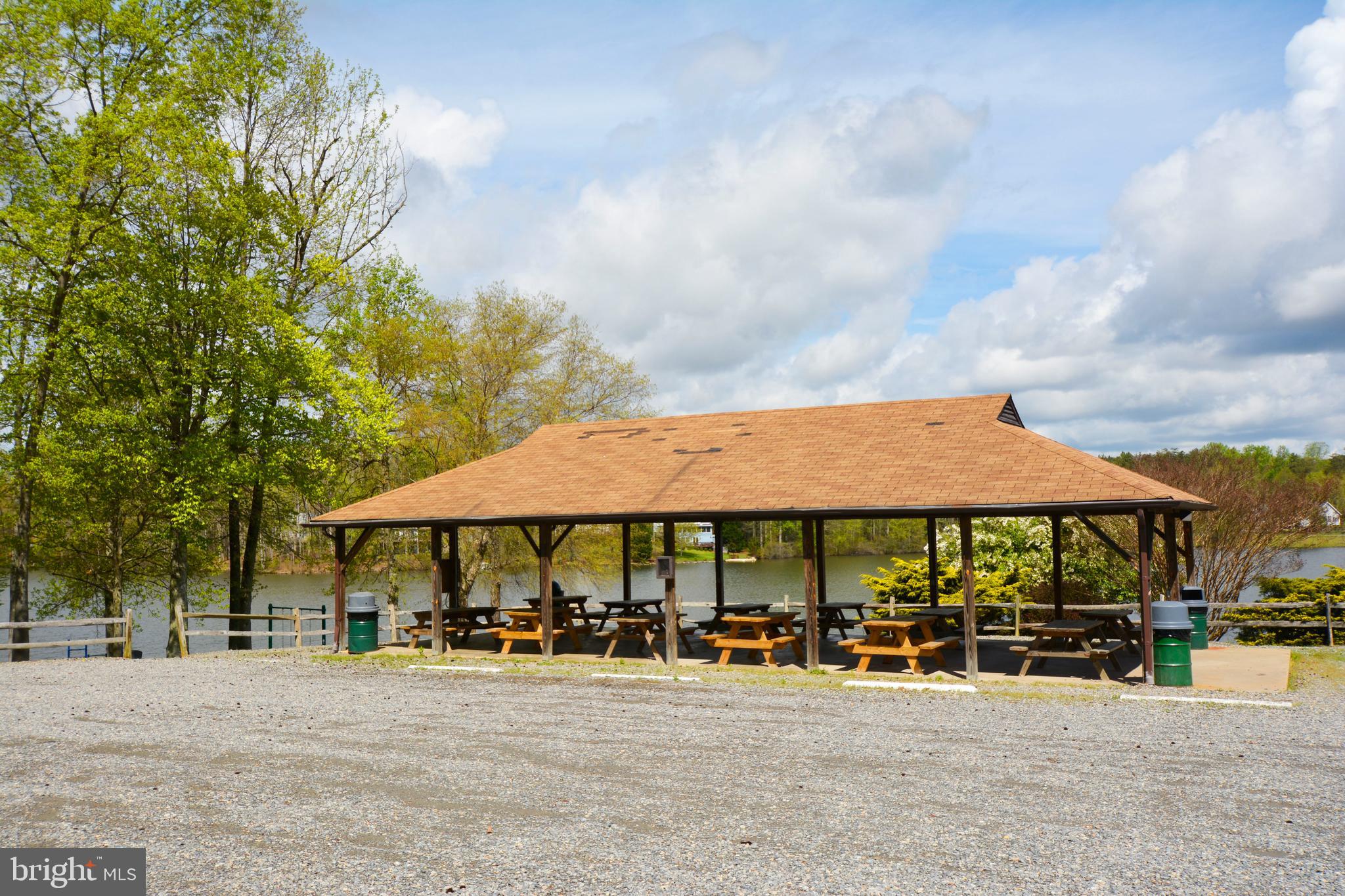 28 Benner Loop Ruther Glen, VA 22546 - Photo 4 of 54 a patio with a table and chairs under an umbrella