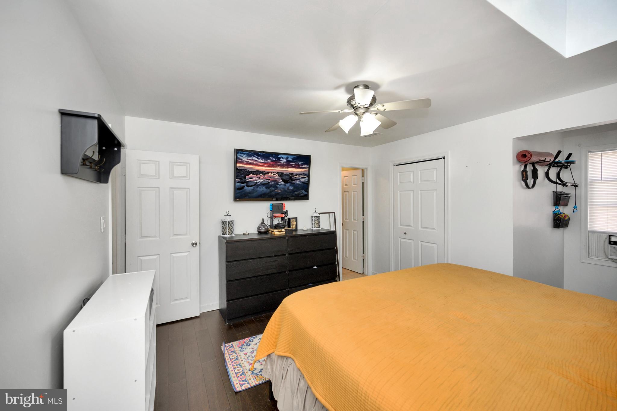 28 Benner Loop Ruther Glen, VA 22546 - Photo 41 of 54 a bedroom with a bed and a flat screen tv