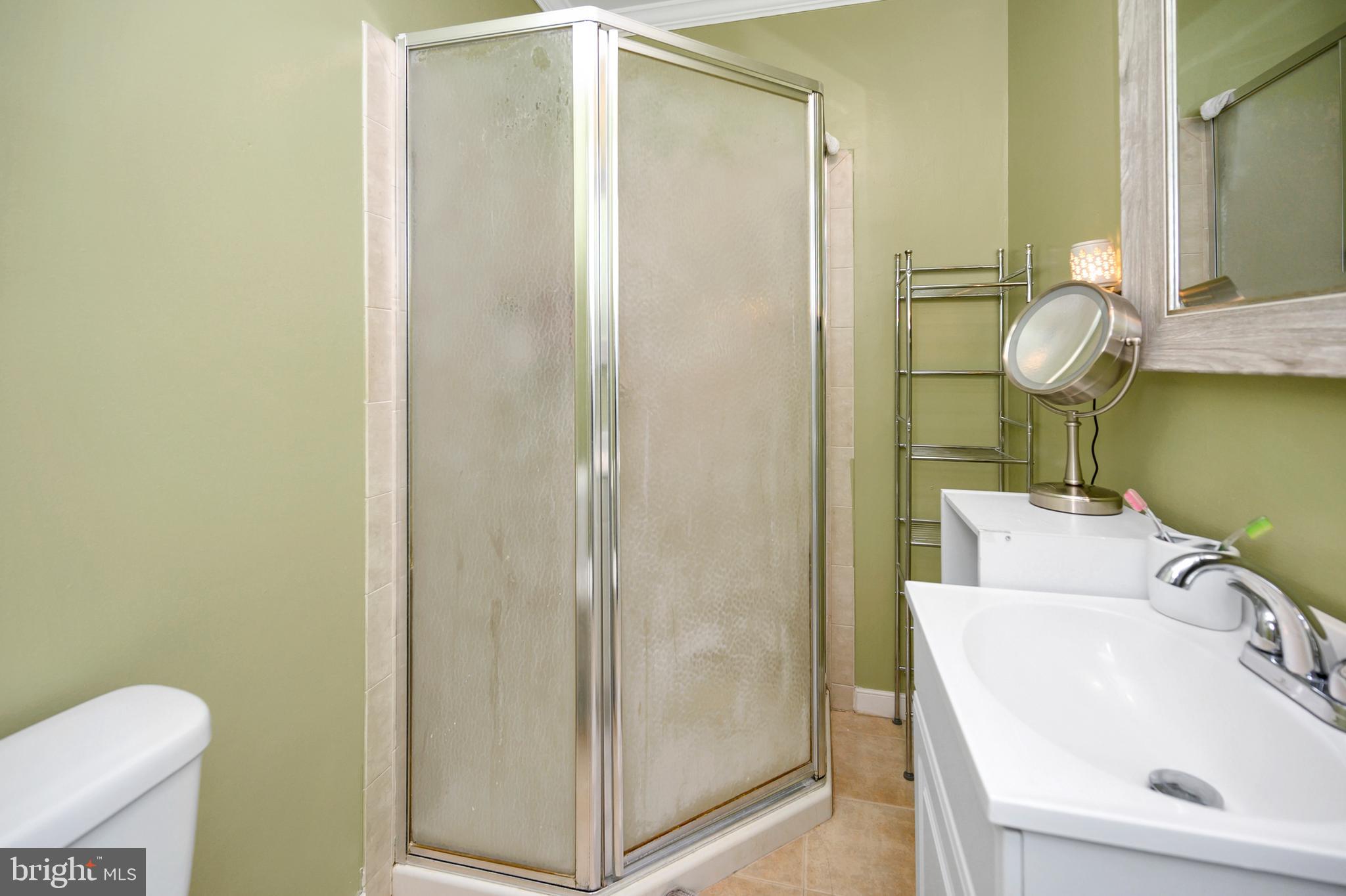 28 Benner Loop Ruther Glen, VA 22546 - Photo 42 of 54 a bathroom with a sink a toilet and shower