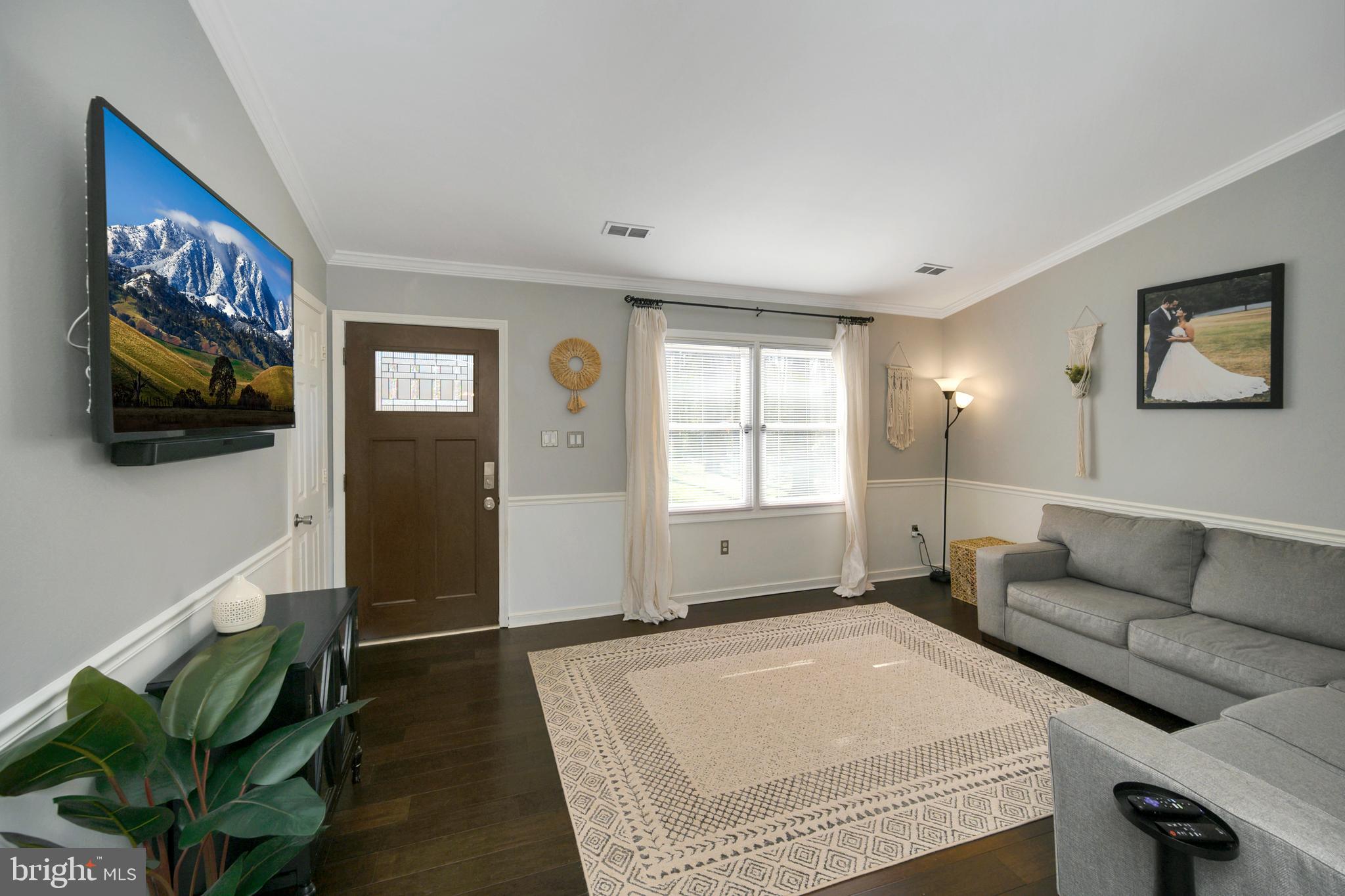 28 Benner Loop Ruther Glen, VA 22546 - Photo 49 of 54 a living room with furniture and a flat screen tv