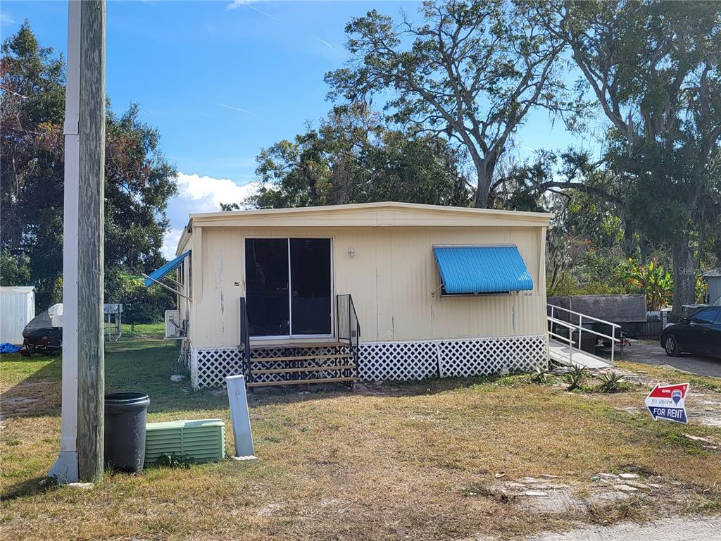 14922 Diagonal Road Hudson, FL 34667 - Photo 1 of 1 a front view of a house with a yard